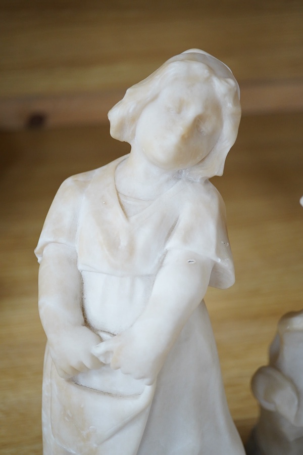 Two 20th century carved alabaster figures of young girls, one of a Dutch girl, the other larger, of a girl in a straw hat, 46cm high. Condition - Dutch girl good, girl with straw hat base broken to one corner